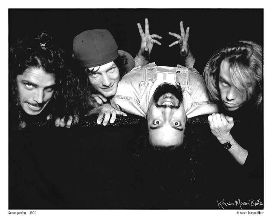 1990 photo of Soundgarden laying down and facing the camera by Seattle grunge music scene photographer Karen Mason Blair. Signed by the photographer, available from Grunge Mart. Includes members Chris Cornell, Kim Thayil, Matt Cameron, and Ben Shepherd.